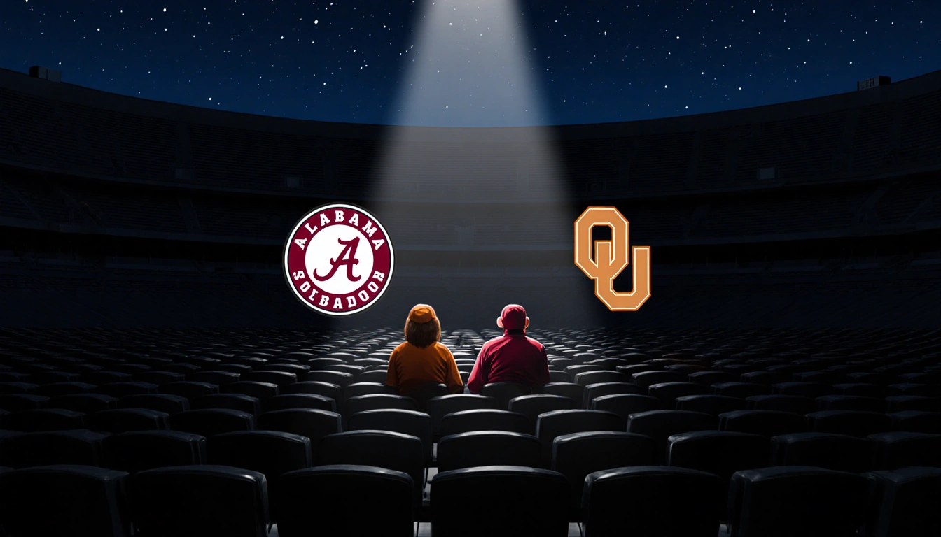 Two lone fans sit in a dim football stadium with a spotlight shining on the underdog Alabama and Oklahoma logos