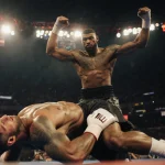 Anthony Joshua stands triumphantly over Jake Paul