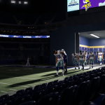 Dallas Cowboys players leaving field in a darkened stadium with Dak Prescott slumping while Vikings bench shows triumphant fa