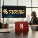 Red envelope resting next to a pen with Netflix logo and cityscape view in a luxurious boardroom