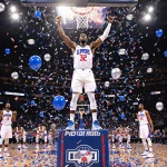 Kawhi Leonard is raising his arms above the court with silver confetti and balloons and the Pistons bench looks upset.