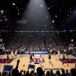 College Aggie and Panther players face off with bright spotlight on volleyball court with confetti and cheering fans