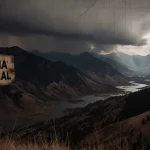 Cracked wooden sign creaks in wind with FEMA denial and wildfire scars and looming storm cloud