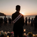 Lone figure holding a candle with a