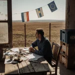 French farmer looking over Argentine plains with faded EU flags and Mercosur crates