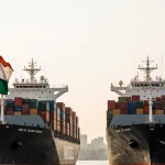 Cargo ships dock side by side with India and New Zealand flags flying and traders exchanging goods under free trade banner in
