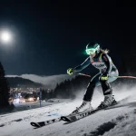 Mikaela Shiffrin skis down a moonlit slalom course with icy patches and misty Semmering resort in background