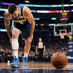 Nikola Jokic limping off the court with a sweat‑stained Nuggets jersey and an abandoned basketball in a bright Miami arena.