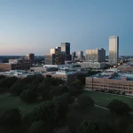 NXP campus aerial view with modern and vintage buildings surrounded by lush green fields