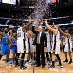 Spurs players high‑fiving coach with confetti exploding and fans cheering in the stands