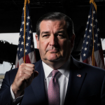Senator Ted Cruz standing before American flag with clenched fist and hangar backdrop
