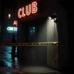 Spotlight shines on security camera with neon signs reflecting off wet pavement and crime tape nearby