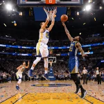 Stephen Curry shooting a high-arcing three-pointer over Jimmy Butler with Warriors bench erupting in confetti