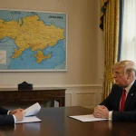 Zelenskyy holding documents with Trump leaning forward near a map of Eastern Europe in a formal meeting room