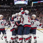 US hockey players celebrating with James Hagens