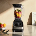 Vitamix blender blending a colorful smoothie with soft warm light on a sleek kitchen counter and scattered recipe books.