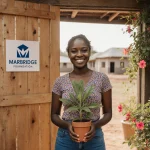 Young woman smiles while holding a potted plant symbolizing growth with wooden community center door and lush greenery behind