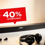 Bose soundbar glowing under golden light with red 40% discount sticker and headphones nearby