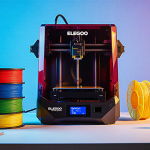 Elegoo Centauri Carbon 2 Combo 3D printer working with stacked red blue green yellow prints and workshop background