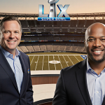 Mike Tirico standing with Cris Collinsworth near an NBC Super Bowl LX broadcast booth with Levi