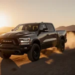 Ram 1500 SRT TRX racing down a desert road at sunset with a golden glow and a visible supercharged engine
