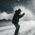 Figure bracing against wind with snowflakes swirling and a dark storm cloud looming overhead
