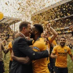 Wolves players celebrating on Molineux Stadium pitch with confetti and golden light